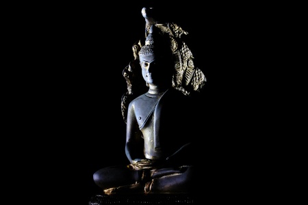 Light of Buddha image in the dark background. の写真素材