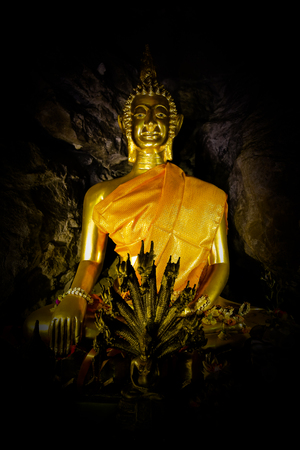 Old ancient buddha statue on backgroundの写真素材