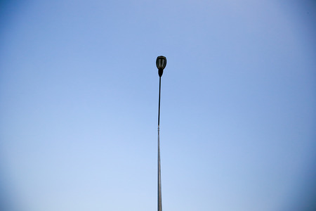Electricity poles on colorful sky at sunsetの写真素材