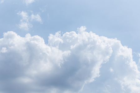 Sky background with the fluffy white cloudsの写真素材