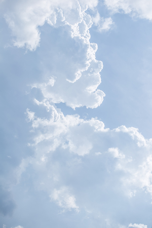 Fantastic soft white clouds against blue skyの写真素材