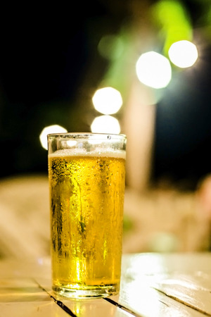 glass of beer on dark backgroundの写真素材