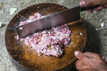 Fresh raw pork on cutting boardの写真素材