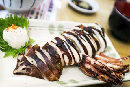 Squid on a Stick. grilled buttered fresh squidの写真素材