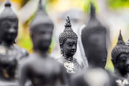 Old ancient buddha statue on backgroundの写真素材