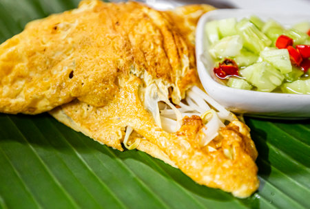 Thai omelet with vegetables on banana leaf. Thai foodの写真素材