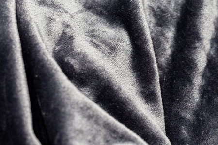 Close-up of a black velvet fabric as an abstract background.の写真素材