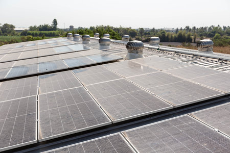 Solar panels on the roof of a building. Photovoltaic modules for renewable electric energy...