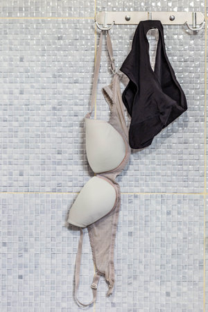 Bikini hanging on a hanger in the bathroom. Top view.の写真素材