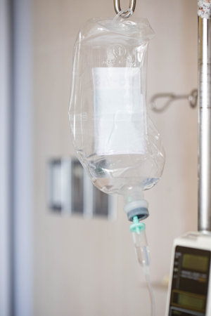 Close-up of an IV drip in a hospital room. Horizontalの写真素材