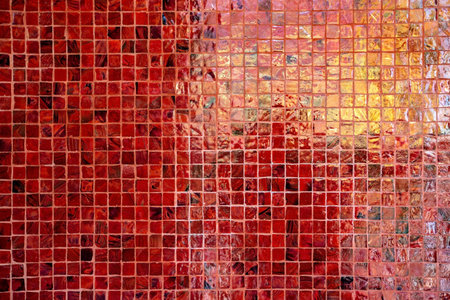 Mosaic wall texture. Colorful mosaic background. Red, orange and yellow tiles.