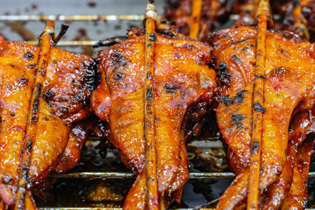 Grilled chicken on the street food market in Thailand, Asia.の写真素材