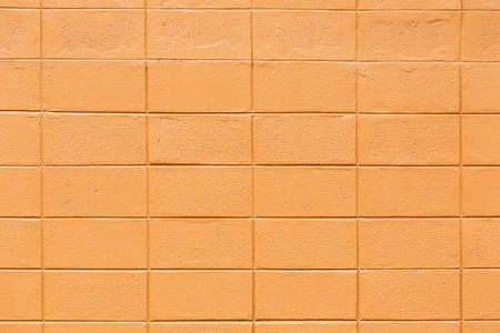 Orange brick wall texture. Background and texture for graphic design or wallpaper.