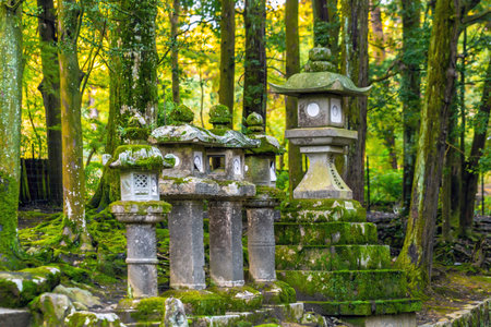 Stone lanterns in the garden of a Japanese temple in Kyoto, Japan