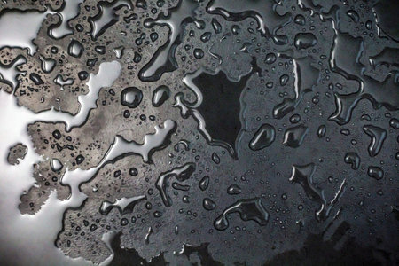 Water drops on a metal surface. Water drops on a metal surface.