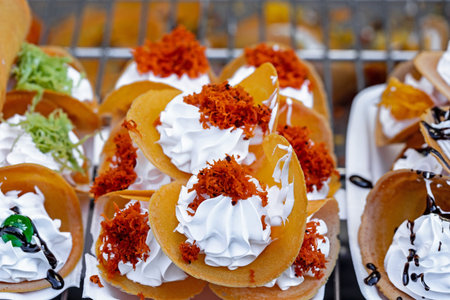 Pancakes with whipped cream and marmalade on a standの写真素材