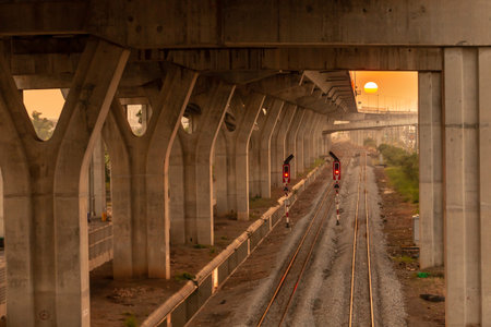 railway under the bridge at sunset, Bangkok,Thailand.