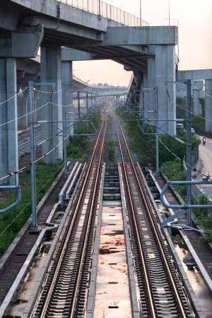 Railway tracks in the city, view from below into the sky