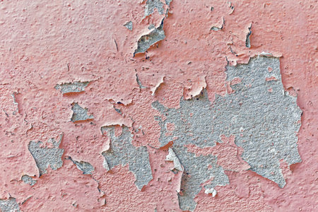 Peeling paint on a wall as an abstract background. Texture.