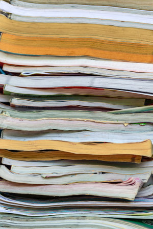 Pile of old magazines close-up. Shallow depth of field