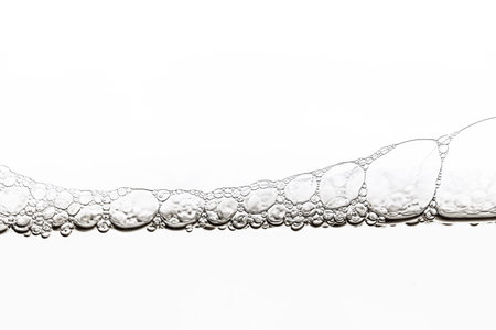 close up of bubbles in water on a white background. studio shot