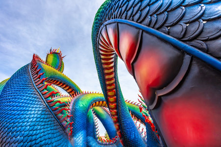 Colorful dragon statue with blue sky background at Chiang Rai, Thailand.の写真素材