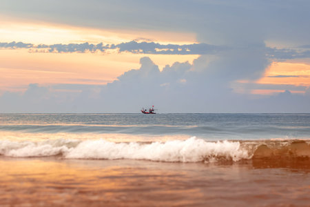 Fishing boat on the beach at sunset, Phuket, Thailand
