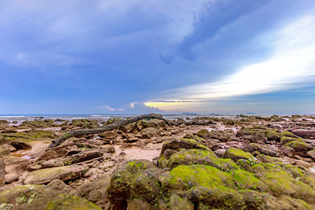 Rocky beach with blue sky background at Phuket, Thailand