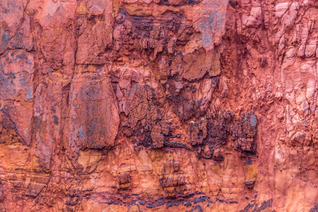 Close up of red sandstone layers. Texture of red rock.