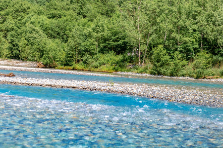 mountain river in summer with blue water and rocks, nature series
