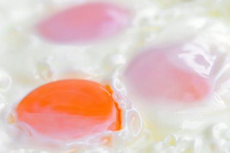 Fried eggs in a bowl close-up. Shallow depth of field