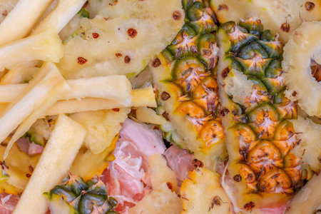 Pineapple slices with ham and french fries, close-upの写真素材