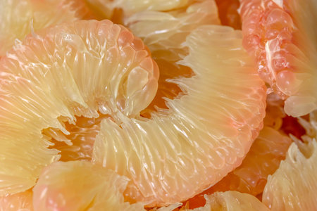 Peeled pomelo fruit as a background, close-upの写真素材