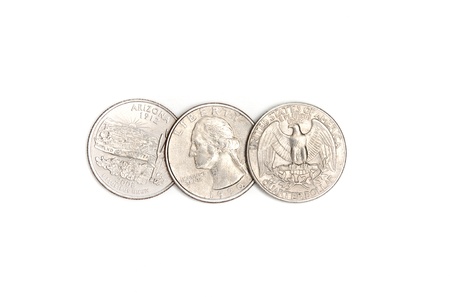 Dollar quarters coins on a white background. の写真素材