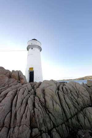 view of rocks and a lighthouse in north sardinia, Palauの写真素材
