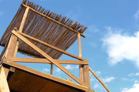 wooden watch tower on blue sky with cloudsの写真素材
