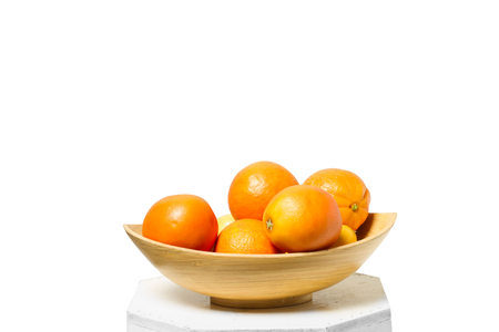 Ripe orange isolated on bowlの写真素材