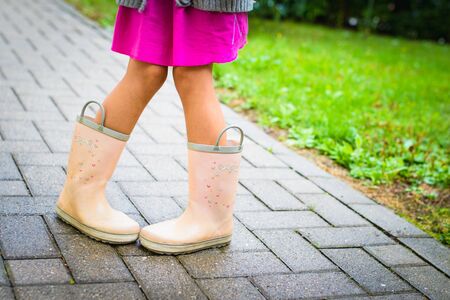 little girl in rubber boots, leg's shot,の写真素材