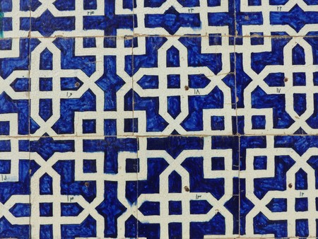 Ancient wall of majolica of a religious building with geometric shapes in Uzbekistan.