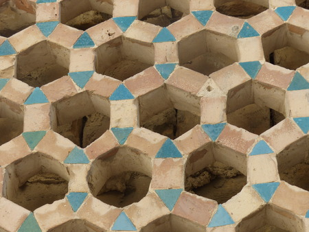 Decorated wall with heptagon-shaped holes in Uzbekistan.