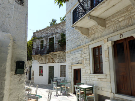 Narrow street in a traditional Naxos village in the Cyclades Islands in Greece.の写真素材