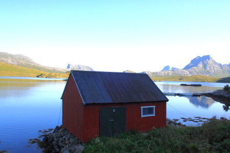 Isolated fisherman's cottage on the sea edge in the Lofoten Islands in Norway.