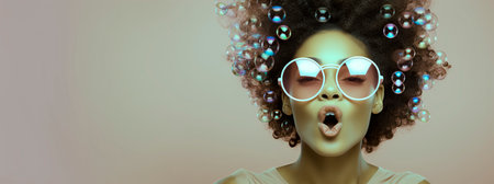 Surprised afro american woman with curly hair and round sunglasses, panoramic bannerの素材