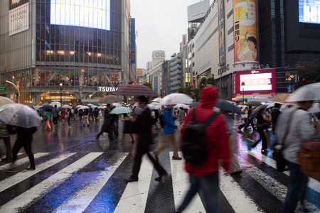 SHIBUYA, TOKYO-CIRCA JUNE 2014: Shibuya scrambled crossing is one of the busiest of the world on circa June 2014のeditorial素材