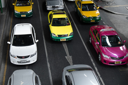 BANGKOK, THAILAND - 14 FEBURARY 2014: Taxis make up more than half of vehicles on the road in Bangkok. It is the major cause of traffic jam.のeditorial素材