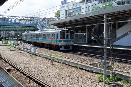 TOKYO, JAPAN - CIRCA JULY, 2014: JR Commutor trains are the main mode of transportation in Tokyo. JR is owned by the government of tokyo.のeditorial素材