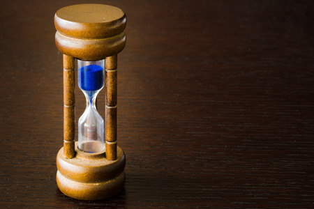 Hourglass or sand glass on a table