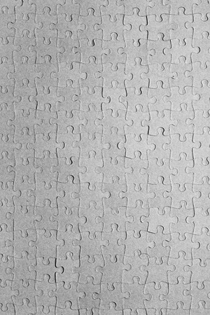 Empty jigsaw puzzle pattern in greyの写真素材