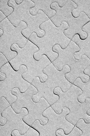 Empty jigsaw puzzle pattern in greyの写真素材