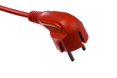 Red electrical plug isolated on white backgroundの写真素材